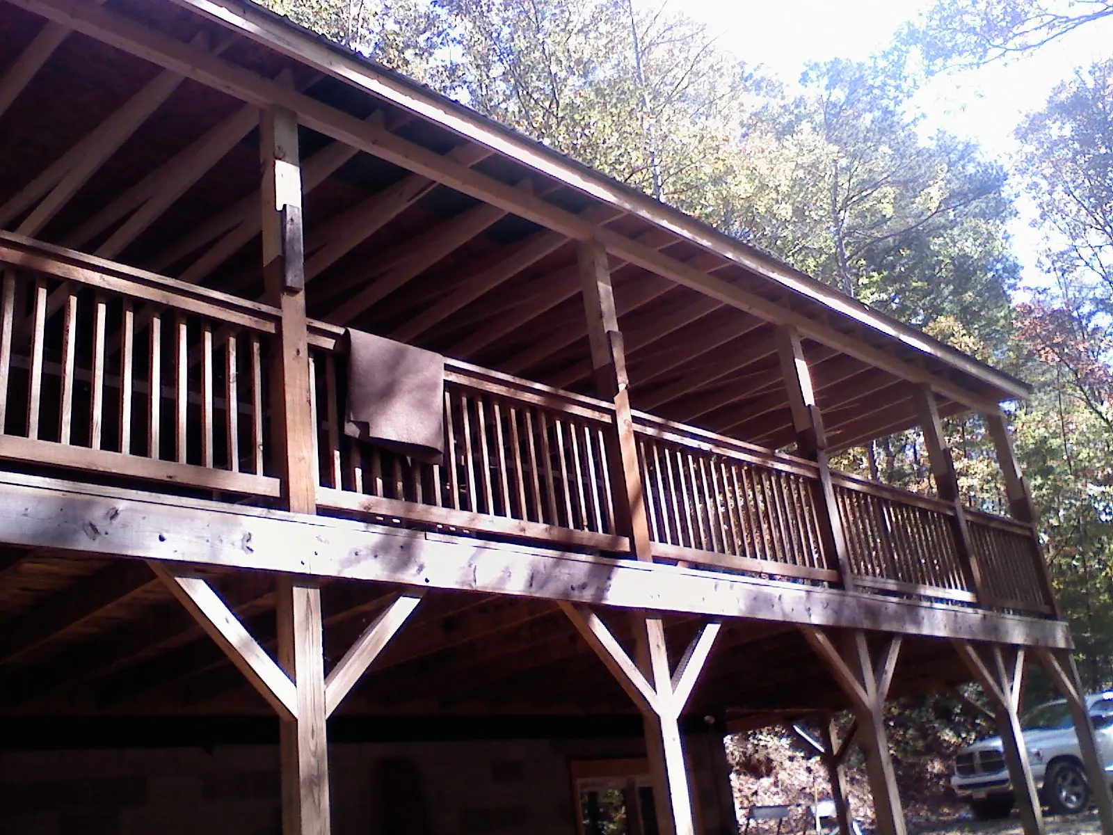 Timber framing under a new elevated porch and deck — Roof Leak Repair in North Falmouth by Roofing Brothers